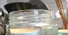 a glass jar filled with liquid sitting on top of a counter