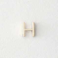 the letter h is shown on a white surface