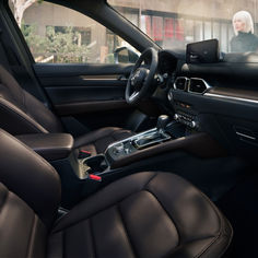 the interior of a car with black leather seats