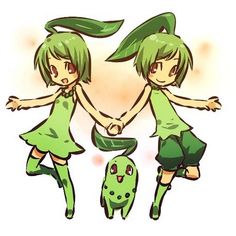 two girls in green dresses holding hands and standing next to each other