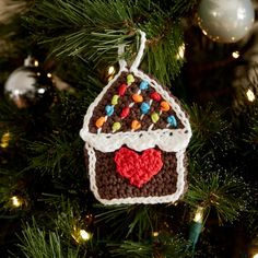 a crocheted ornament hanging from a christmas tree