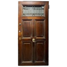 an old wooden door with glass inserts