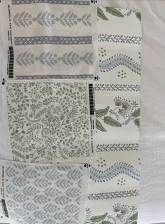 three different types of cloths with designs on them, one is white and the other is green