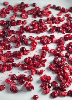 cranberry sauce is being poured onto a white surface