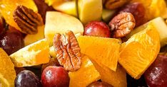 various fruits and nuts are mixed together to make a healthy snack for the whole family