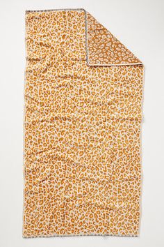 an orange and white animal print blanket