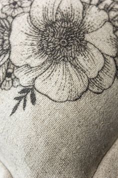 A detail image of the hand screen printed motive of our hideaway cushion. You can see a high quality print flower on linen fabrics. Geometric Tattoo