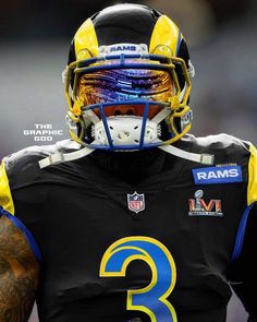 a close up of a football player wearing a black uniform with yellow and blue accents