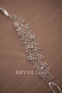 Make a beautiful entrance with this elaborate bridal sash with satin ribbon. Shiny rhinestones and fine pearls decoration make it more glamorous, perfect for simple wedding gowns. shown ribbon color light ivory content rhinestone crystal ribbon pearl alloy embellished portion length 40cm, width 6cm ribbon length 100cm, width 1cm