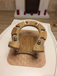 a wooden steering wheel on top of a table