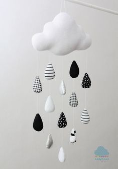 a white cloud with black and white designs hanging from it