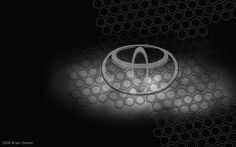 the toyota logo is shown in this black and white photo with hexagonal background