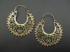 Premium gold/silver plated brass earrings with unique and intriguing design patterns. RETURNS: Our major goal is to present all products as promised with accurate item descriptions along with pictures. But there are times when you may need to return occasionally. Returns are happily accepted but then we kindly request you to complete all your return within 30 days of receiving your item/s. **All the item/s must be returned unused and without any damage in the same condition you received it, with Small Hoop Metal Earrings For Festivals, Metal Hoop Earrings With Intricate Dangle Design, Hoop Earrings For Festivals, Nickel-free Drop Hoop Earrings For Festivals, Gold Plug Earrings For Festivals, Brass Filigree Dangle Hoop Earrings, Silver Brass Hoop Earrings With Intricate Design, Small Hoop Pierced Earrings For Festivals, Nickel Free Gold Hoop Earrings For Festivals