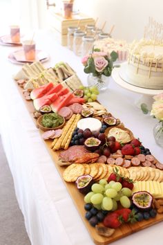 a table topped with lots of different types of foods and desserts on top of it