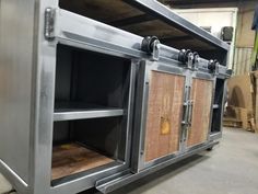 an industrial style metal and wood cabinet in a warehouse