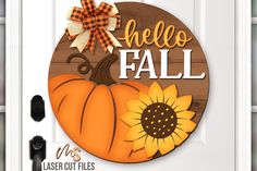 a door hanger that says hello fall with a sunflower and a bow on it