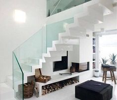 a living room filled with furniture and a stair case