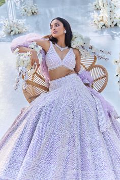 This lehenga set features pearl, sequin & crystal embroidery on a lavender net base. The skirt is paired with fully embellished blouse with dual strings at the back and a matching scalloped net dupatta.From Seema Gujral's Tuscan Summer collection. DELIVERY TIMEPlease allow 8-12 weeks for your outfit to arrive. FABRIC DETAILSNet Professional cleaning only. Tuscan Summer, Lehenga Designs Simple, Crystal Embroidery, Bridal Dress Fashion, Fashion Forecasting