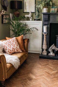 a living room filled with furniture and a fire place next to a wooden burning stove