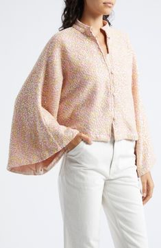 A pastel field of daisy sequins sparkles on this cropped jacket cut in a boxy silhouette featuring dramatic bell sleeves and a button-and-loop placket. 20" length (One Size) Front button-and-loop closure Band collar 70% polyester, 30% cotton Dry clean Made in the USA Designer Clothing Designer Clothing Brands, White Houndstooth, Band Collar, Tailored Jacket, Cropped Jacket, Peach Pink, Style House, Crop Jacket, Bell Sleeve