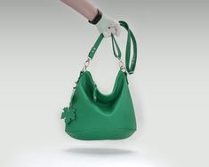 I made this hobo bag of soft Italian pebbled leather  in green. If you want to change the color, select it in the menu when buying. This bag model exists in three sizes: L, M, S. Please select the size you want when buying. This soft comfortable bag is also quite roomy.  The soft form and two detachable handles (a short round handle and a long crossbody belt ) make this bag comfortable for daily use.  This purse has an outer zippered pocket. The zipper on top will keep everything safe inside.  Inside the bag is one compartment, a pocket with a zip, and two open pockets. )Measurements: ( L ) Height 14" Length 14 " Measurements: ( M ) Height 12" Length 12 " Measurements: ( S ) Height 10" Length 10 " short round handle  23 " The length of the shoulder strap is 52 " - 30" Green Leather Hobo Bag With Handle Drop, Green Leather Bag, Round Handle, Bag Model, The Menu, Green Leather, Crossbody Purse, Hobo Bag, Pebbled Leather