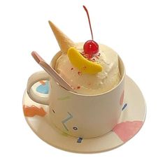 an ice cream sundae on a saucer with a spoon and cherry in it