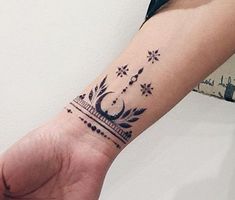 a person's arm with a tattoo on it and a clock in the middle