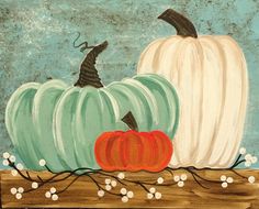 two pumpkins sitting on top of a wooden shelf