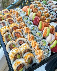 many different types of sushi are on display