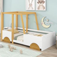 a child's bed with a wooden frame and wheels