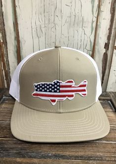 USA Bass Red/White/Blue Patch Trucker Hat AG Outfitters Exclusive Design! Richardson 112 brand hat Please send wholesale inquiries to mike@agoutfittersnc.com. White Cotton Trucker Snapback Hat, Patriotic White Hat For Summer, White Trucker Snapback Hat With Short Brim, Patriotic Hats For Outdoor, One Size Fits Most, White Patriotic Adjustable Trucker Hat, White Americana Hat With Adjustable Fit, White Adjustable Americana Hat, Casual White Pre-shrunk Snapback Hat, Patriotic White Trucker Hat With Curved Brim