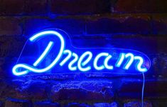 a neon sign that says dream on it