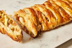 a pastry is cut in half on a cutting board