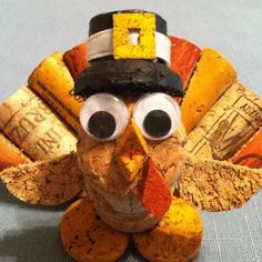 a turkey made out of wine corks with a hat on it's head