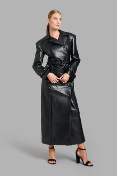 Black faux leather classy trench coat with wide shoulders and shoulder pads. Sleeves are decorated with belts, belt loops, and exserted stitches. Free worldwide shipping! Delivery time: 6-8 days Leather Aesthetic, Faux Leather Trench Coat, Wide Shoulders, Leather Trench, Leather Trench Coat, Cape Coat, 8 Days, Coat Dress, Black Faux Leather