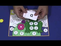 a child is playing with a letter matching game