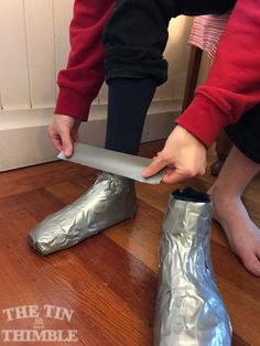 a person in red shirt and silver boots