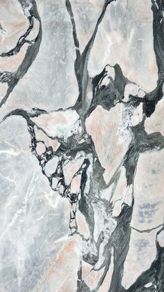 an abstract marble pattern with black and white paint on it's surface, as seen from above