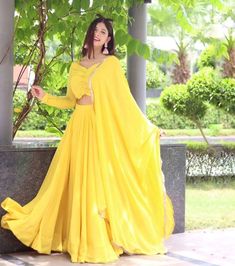 This gorgeous yellow lehenga set comes with a circular lehenga, plain yellow faux georgette dupatta and cropped blouse for a haldi and any other functions. Pair it with the plain dupatta and blouse and golden accessories for your next special occasion. #yellowlehenga #yellowlehengas #yellowlehengacholi #yellowlehengadesigns #yellowlehengadress #designeryellowlehenga Yellow Crop Top Lehenga, Yellow Lehenga Choli, Plain Yellow, Lehenga Style, Kurta Designs Women, Bridal Lehenga Choli, Fancy Blouses