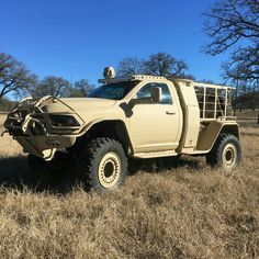 an off - road vehicle parked in the middle of a field