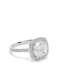 a cushion cut diamond ring with pave set diamonds on the shoulders and sides, in white gold