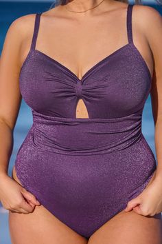 The Atlantis Plum Lurex Keyhole One-Piece offers a touch of shimmer with its lurex fabric and a hint of allure with its keyhole detail, making it a unique addition to your collection. Product code: CAA12E4B027VZ Features:  V-neckline  Adjustable straps  Removable soft cups  Medium bust support  Shirred bust  Front keyhole  High-cut leg  Modern cheeky bum coverage Wash Method: Regular Wash Lining: 92%POLYESTER,8%SPANDEX Material: 77%NYLON,13%SPANDEX,10%METALLIC. Elegant Metallic Swimwear, Elegant Purple Party Swimwear, Lurex Fabric, Atlantis, High Cut, Plum, Adjustable Straps, One Piece