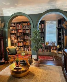 a living room filled with furniture and bookshelves