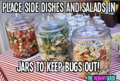 jars filled with food sitting on top of a table