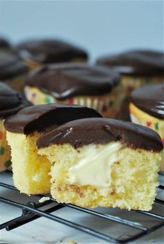 cupcakes with chocolate frosting and sprinkles on cooling rack