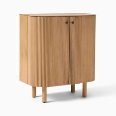 a wooden cabinet with two doors and legs