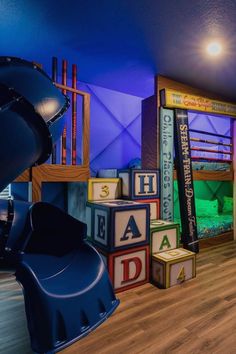 children's play room with wooden blocks and slides