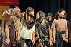 a group of young people standing next to each other on a stage with the caption tutspeople of agrabat one jump