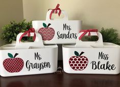 four white containers with red apples and mr and mrs on them, each holding an apple