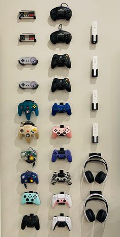 there are many video game controllers hanging on the wall